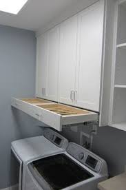 When needed it extends out easily to provide 10 hanging racks; 14 Install A Hideaway Drying Rack Laundry Room Remodel Small Laundry Rooms Laundry Room Decor