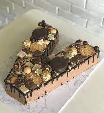 Pipe chocolate in the shape of any letters or numbers you desire. Letter Chocolate Cake Alphabet Cake Cake Lettering Biscuit Cake