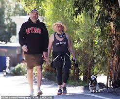 Ricki Lake holds hands with her fiance Ross Burningham as the pair go for a  walk in Malibu