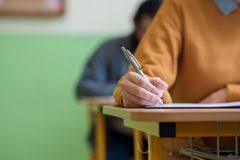 Happy student with thumbs up in a classroom. 1 800 Students Free Stock Photos Stockfreeimages