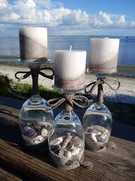 Make these adorable little wine glass snow globe candle holders for christmas decor! 92 Sand And Seashells Wine Glass Candle Holders Ideas Wine Glass Candle Holder Wine Glass Candle Candle Holders