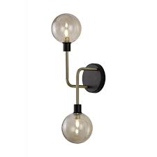 Versatile and distinct, this contemporary fixture makes a strong statement on style, perfect for a modern bathroom or vanity. 2 Light Wall Light Black Brass Globe Shades Lighting Company Uk