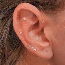 Ear Curation On Instagram Flat Forward Helix Mid Helix And Triple Lobe Piercings Helix Pierced By Cx Triple Lobe Piercing Ear Piercings Lobe Piercing