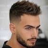 On this men's haircut for thin hair, the back and sides are cut and tapered white the crown is cut longer following the shape of the head. 1