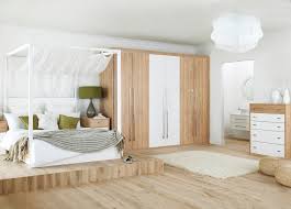Above is a small wood dresser akin to the bachelor style with silver hardware and a row of sock drawers above. White Bedroom With Wood Furniture Novocom Top