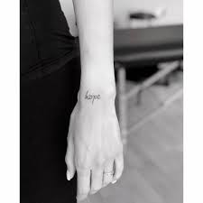 The sad whale wrist tattoo is a symbol of hope and living for the sea creatures. Hope Lettering Tattoo On The Wrist