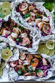 Low carb chicken foil packets with cauliflower rice, tomatoes, capers and lemon are great on the grill or baked in the oven. Foil Packet Shrimp On Grill Keto Low Carb Ketogasm