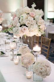 This Beautiful Centerpiece Creates A Romantic Scene With The Roses Hydrangeas And Tall Wedding Centerpieces Wedding Centerpieces Wedding Flower Arrangements