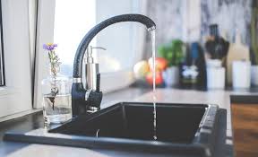 A stainless steel range and oven is flanked by classic white cabinets with nickel hardware. Don T Forget About The Sink In Your Kitchen Remodel Jamco Unlimited