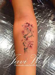 Cherry Blossom Love The Tiny Details Tattooed By Javi Wolf Tattoos Watercolor Tattoo Flower Blossom Tattoo