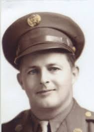 Glidden native honored with flag raising