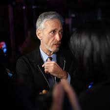 They gather under the jon stewart who is funny and who, with his dark backswept hair set off by graying temples, is a few years younger than the jon stewart of today. Jon Stewart Returns With A Series For Apple Tv The New York Times