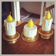 Hands made from oatmeal containers, small plastic plate, sour cream container, gold duct tape. Lumiere Costume Hands Made From Oatmeal Containers Small Plastic Plate Beauty And The Beast Diy Beauty And The Beast Costume Beauty And The Beast Halloween