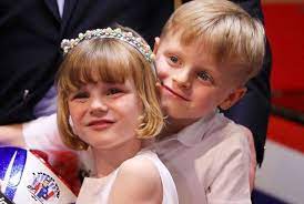 The wife of prince albert attended a christmas gift distribution event on wednesday and showed off her dramatic new half hawk haircut. Qxxlntww7qf9gm