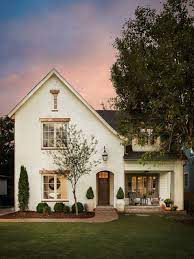 The exterior is highlighted by stone, white siding, and a unique wood garage door. 75 Beautiful White Brick Exterior Home Pictures Ideas July 2021 Houzz