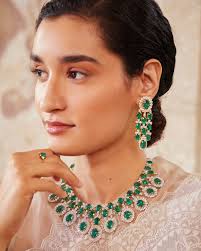 Bijou Bijou ~ Through the spectrum of colours The diamond and the emerald  share an ancient romance. Experience the heady mystique of these gemstones  with our statement necklace set designed using Zambian