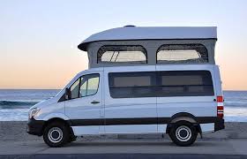 A Sprinter With A Roof Tent Is Parked In The Wild Custom Camper Vans Mercedes Benz Vans Van Camping