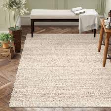 This one, for example, is handwoven in india and features a 0.98 pile height, making it the. Beachcrest Home Othello Handwoven Wool Cream Rug Reviews Wayfair