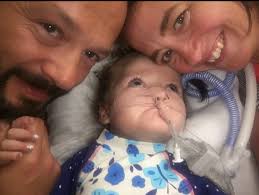 Moving photos show a four-year-old girl who loved water swim for the first  time… just two days before she died from one in 168 million condition