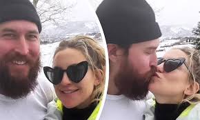 Kate Hudson shares a quick kiss and lots of smiles with her fiancé Danny  Fujikawa