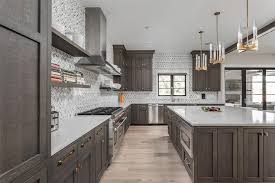 Do you want the perfect cabinet color for your wallpapered kitchen? White And Gray Marble Herringbone Tiles With Dark Brown Cabinets Transitional Kitchen