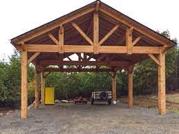 Wood carports are commonly built with a hip roof, gable roof or a flat, shed type roof. Easily Build Your Own Carport Rv Cover Western Timber Frame