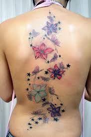 If you're aiming for a larger tattoo that includes multiple elements like hearts, flowers, or the dog design, it'll be over $100. Butterfly And Flower Tattoos Star Tattoos Design