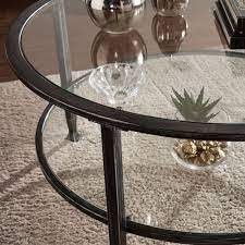 This piece comes in your choice of available finishes, polished for an extraordinary shine, and topped in thick, clear glass, tempered for extra strength. Southern Enterprises Jaymes Black Metal And Glass Round Cocktail Table Ck8740 Bellacor In 2021 Round Metal Coffee Table Round Glass Coffee Table Coffee Table