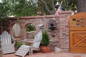 Start laying the pavers along the edge of the layout. How To Build A Brick Patio Reclaimed Patio Pavers