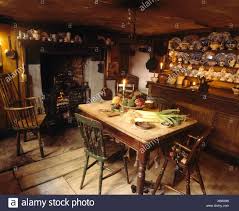 antique windsor chair beside fireplace