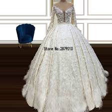 Ungefähr 12% davon sind hochzeitskleider, 7% sind übergröße kleid & röcke, and 1% sind brautjungfernkleider. Heisse Promo 0 Off Dubai Luxus Federn Langarm Brautkleider Illusion O Neck Puffy Ballkleid Spitze Brautkleider Vestidos De Novia