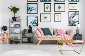 I think that interior design is in a very interesting phase today. Gold Metal Table Standing In White Living Room Interior With Decor On Black Metal Racks Fresh Green Plants Light Grey Sofa With Stock Photo Image Of Lounge Black 119413690