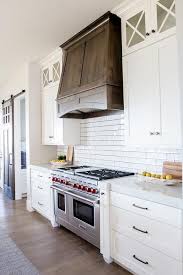 A Wolf Dual Range Sits Between White Shaker Cabinets Accented With Oil Rubbed Bronze New Kitchen Cabinets Shaker Kitchen Cabinets White Shaker Kitchen Cabinets
