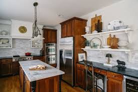 From the two toned cabinets to the beautiful mosaic glass tile backsplash and the granite countertops, i am in love with my kitchen! Kitchen Desk Cottage Kitchen Sandy Muraca Design