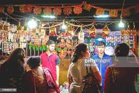 Buyers And Sellers At A Market Stall Of Home Decorations In A Night Incredible India India Travel Inspiration