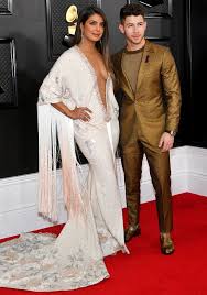 Priyanka Chopra And Nick Jonas Went All Out In A Plunge Dress And Gold Suit At The Grammys Priyanka Chopra Fashion Plunge Dress