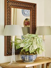 Pair this table lamp with other items from the latchbury collection to complete the look. Carved Mirror With Glass Table Lamps And Indoor Plant In Vase Hgtv