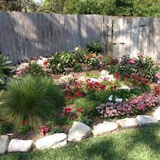 My Mothers Fish Pond Turned Into A Flower Bed Beautiful Outdoor Landscaping Flower Beds Dream Garden