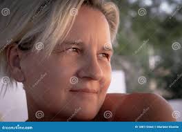 Close-up Portrait of Caucasian Mature Woman with White Hair with Hand