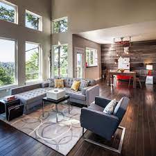 This modern living room showcases bright orange walls contrasted with a grey sofa, round coffee table, and pendant lights. Grey And Beige Tones Living Room Ideas Photos Houzz