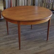 Beautiful two tone casual style round extendable pedestal dining table that offers function, space, and a solid hardwood top in a stunning distressed hardwood finish. Mid Century Teak Round Dining Table With Butterfly Leaf By G Plan Dining Table Round Dining Table Modern Vintage Furniture