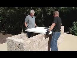 Step up your entertaining game with one of these diy outdoor kitchen plans that you can put outside on an existing patio, deck, or area of your yard. How To Build An Outdoor Kitchen With Rumblestone And Quikrete Countertop Mix Youtube