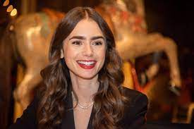 The actress, 30, who is the daughter of phil collins and jill tavelman, looked sensational in a strapless evening gown as she threw herself into filming. 13 Things You Didn T Know About Emily In Paris Star Lily Collins L Officiel Usa