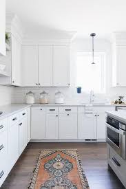 White Shaker Kitchen Cabinets Donning Oil Rubbed Bronze Hardware And White Quartz Counterto White Shaker Kitchen Cabinets Kitchen Soffit Kitchen Cabinet Styles
