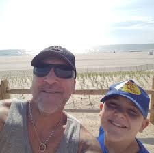 Is it safe to lift a motorcycle using the headers and center stand bracket?