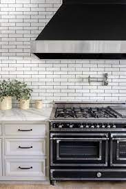 Transformed from a former camp cottage, the kitchen features its backsplash into the benjamin moore's merlot red. 55 Best Kitchen Backsplash Ideas Tile Designs For Kitchen Backsplashes