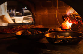 The restaurant offers a menu. Tazza Kitchen Stone Creek Village Cary Nc Wood Fired Cooking Craft Cocktails