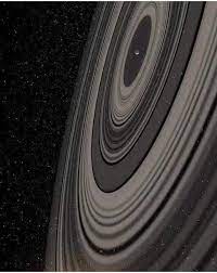 Vue d'artiste de l'exoplanète j1407b avec ses anneaux. Photo Of Planet J1407b It S Ring System Is 200 Times Larger Than Saturn S Ring System The Rings Make The Planet Seem Minuscule In Planets Saturn Light Year