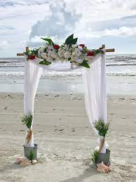 Closeup Of The Sara Two Post Bamboo Wedding Arch At A Beach Wedding In Florida Red White Decor Beach Wedding Arch Bamboo Wedding Arch Mexico Beach Weddings