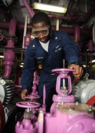 Aviation Boatswain's Mate (Fuel) 3rd Class Henry Flowers, from Shellman,  Ga., opens a valve to transfer